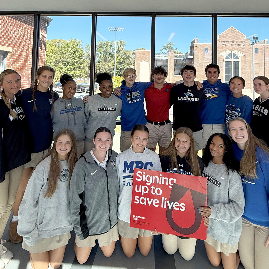 photo of candidate holding a sign